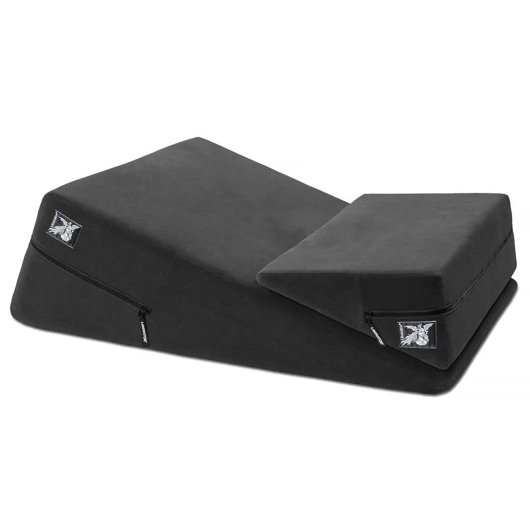 Navy blue wedge-shaped lounging cushion on bed