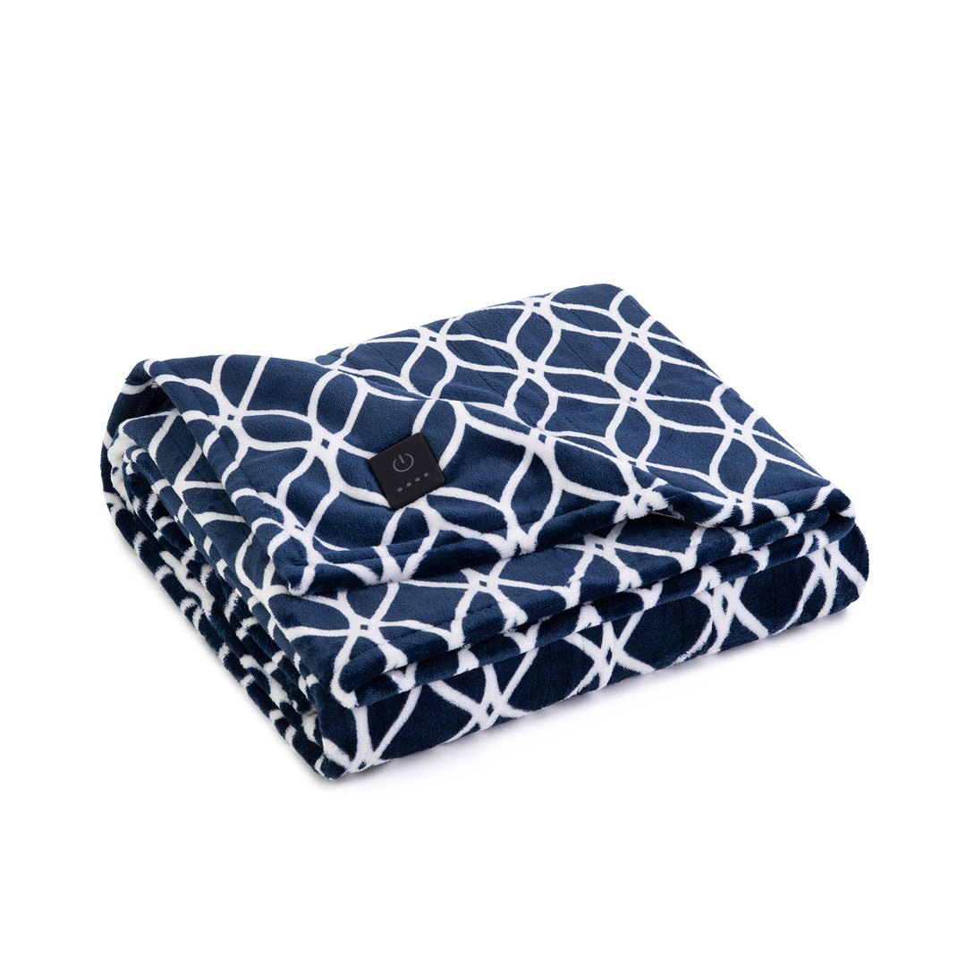 Folded navy heated throw with white geometric pattern and visible power button on a white background.