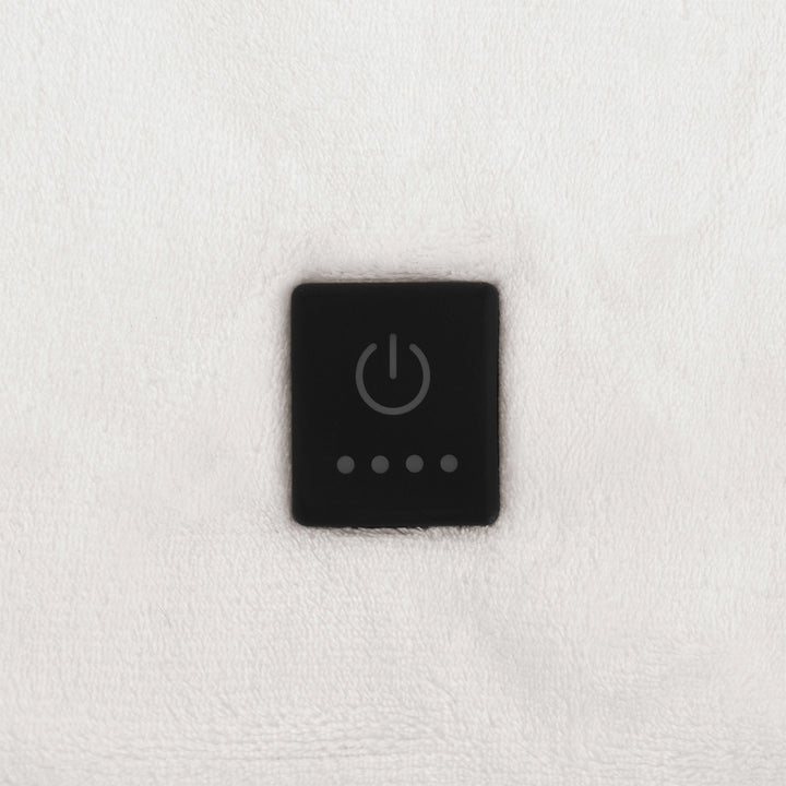 Built-in control button on ivory oversized heated throw.