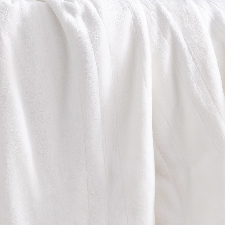 Close-up of the ivory oversized heated throw showing its soft, plush texture.