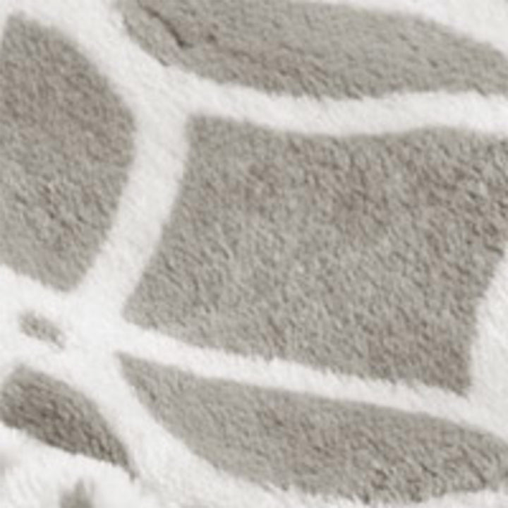 Close-up of taupe plush heated throw with white trellis pattern.