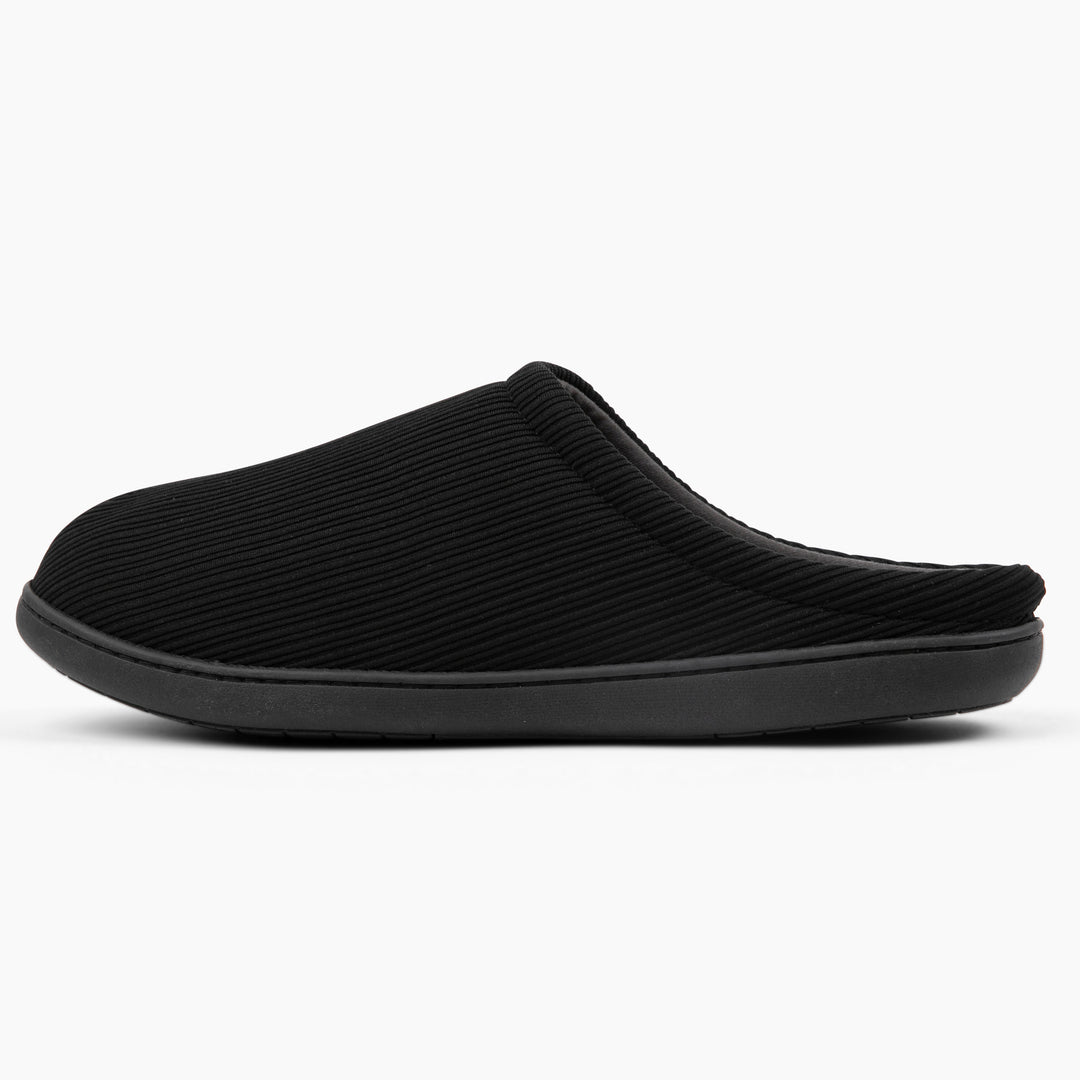Black slip-on shoe on a white background
