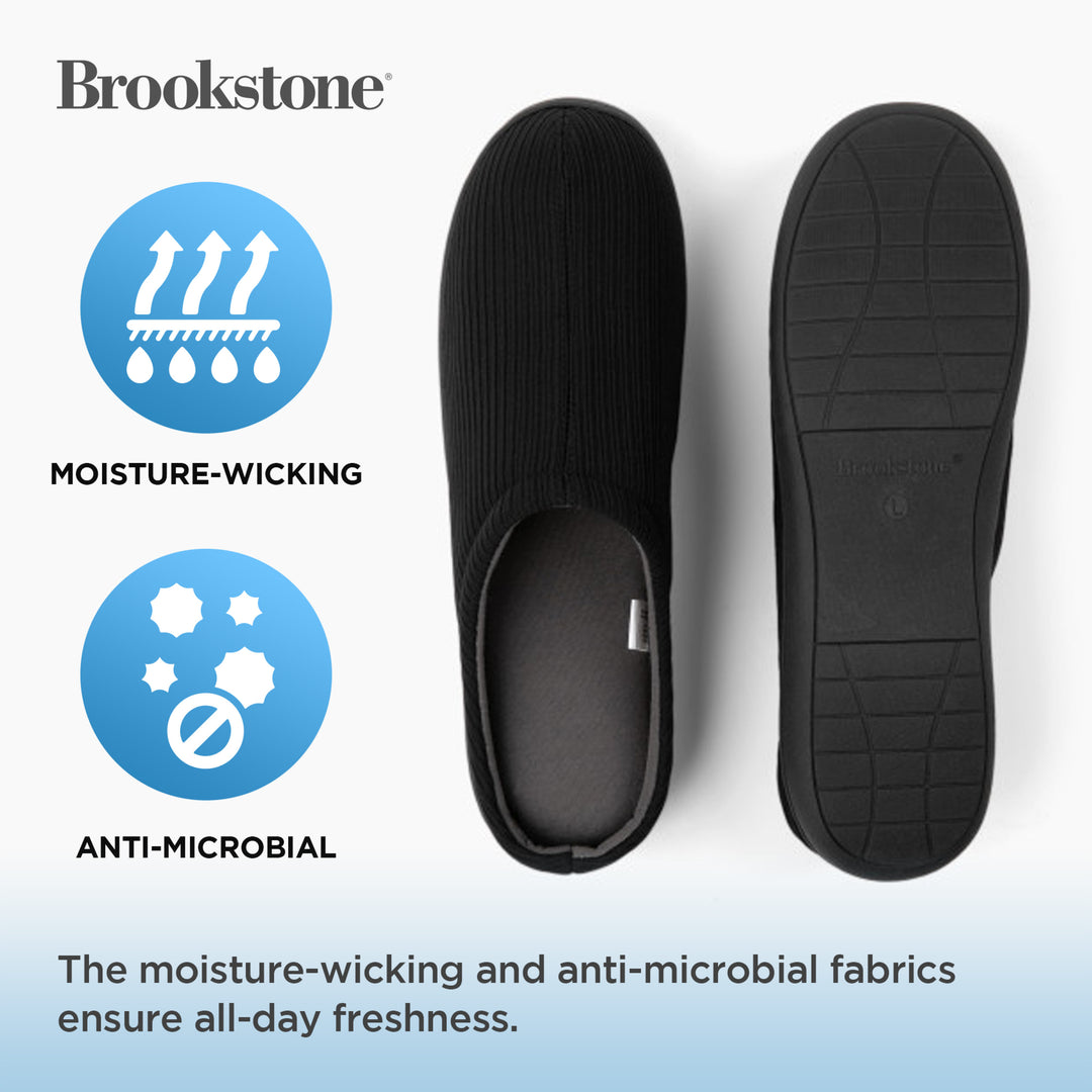 Black slip-on shoe with moisture-wicking and anti-microbial features on a white background, featuring Brookstone branding.