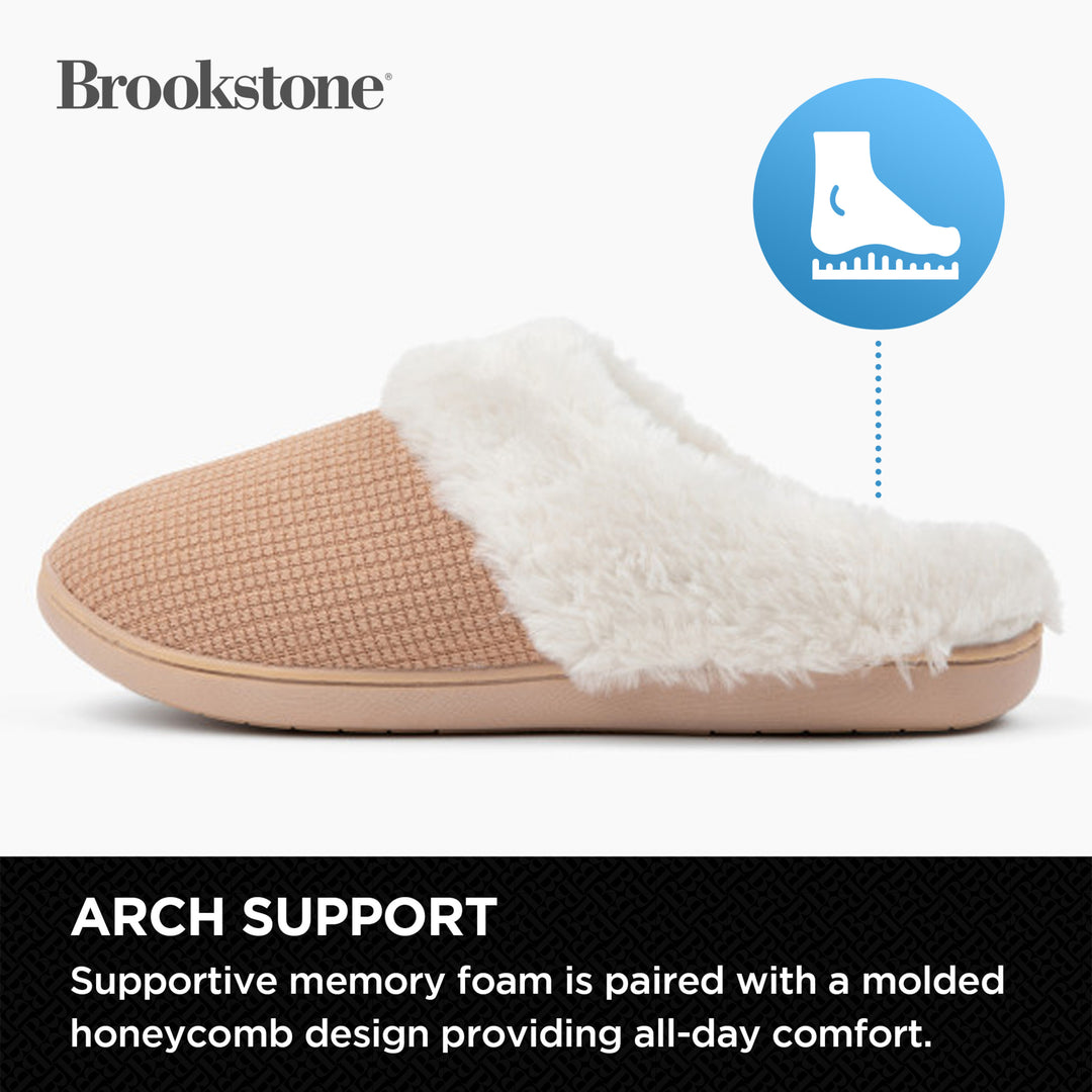 Beige slipper with white fur lining on a white background, featuring Brookstone branding.