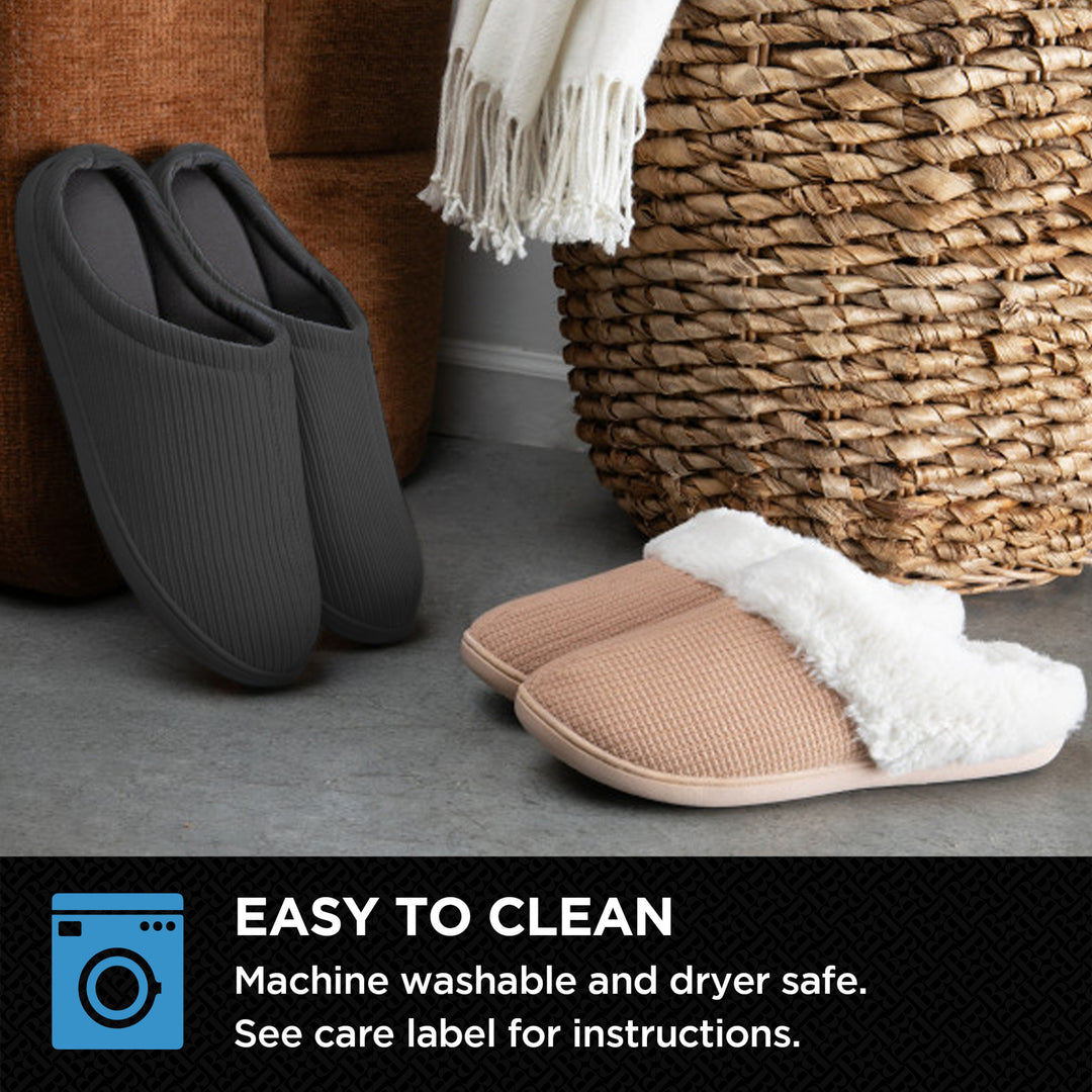 Pair of brown slippers with white lining next to a woven basket on a gray floor.