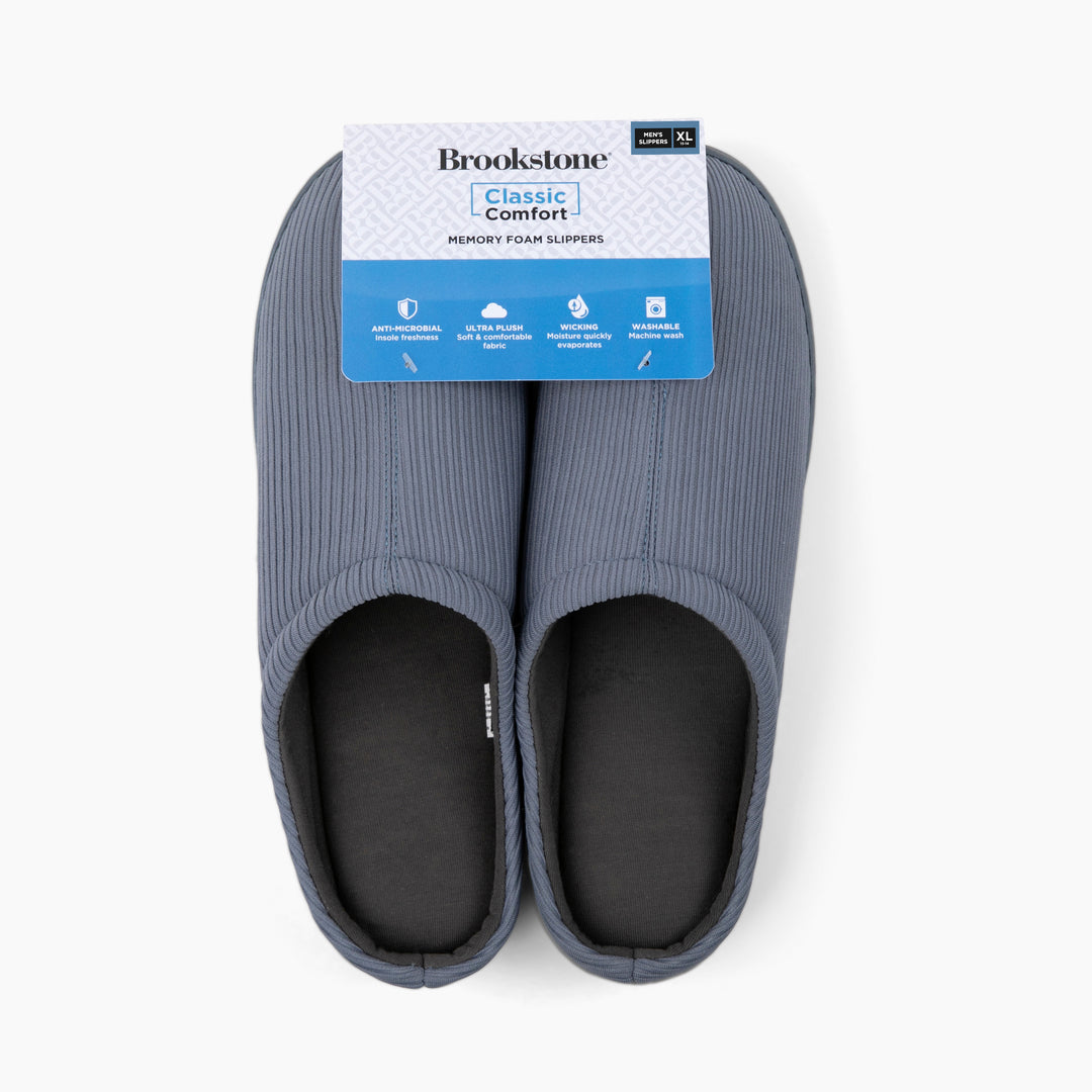 Pair of gray slippers with Brookstone label on a white background