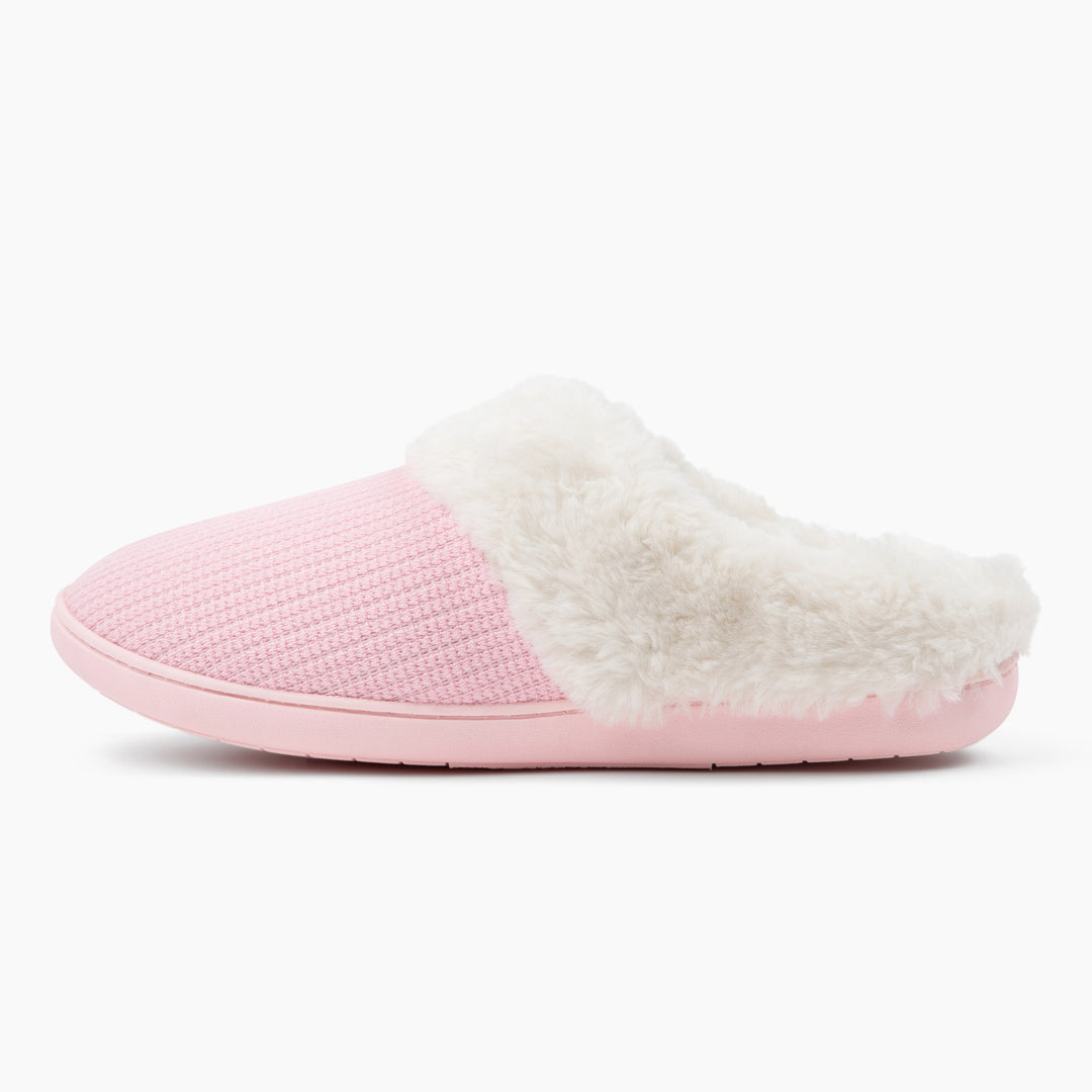 Pink slipper with white fur lining on a white background