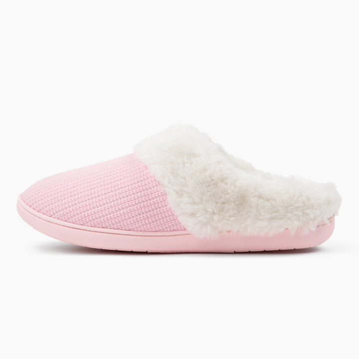 Pink slipper with white fur lining on a white background
