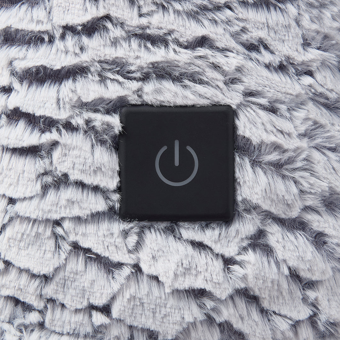 Black power symbol button on a textured gray surface