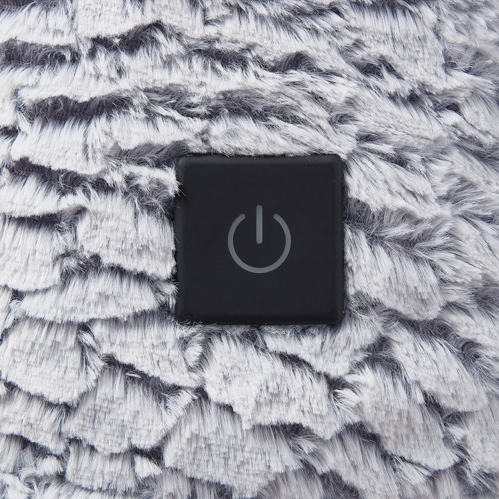 Black power symbol button on a textured gray surface