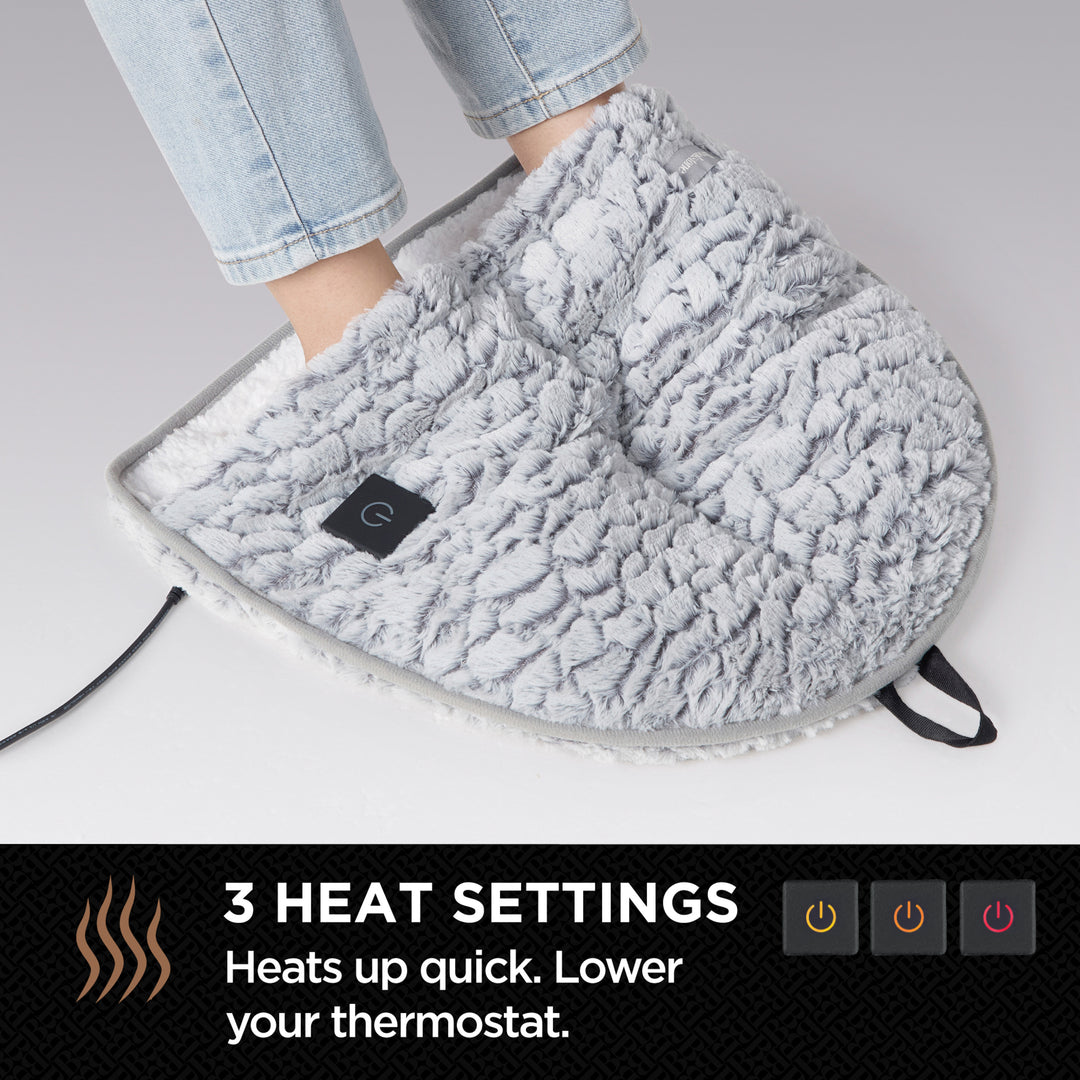 Gray foot warmer with text about heat settings on a gray background