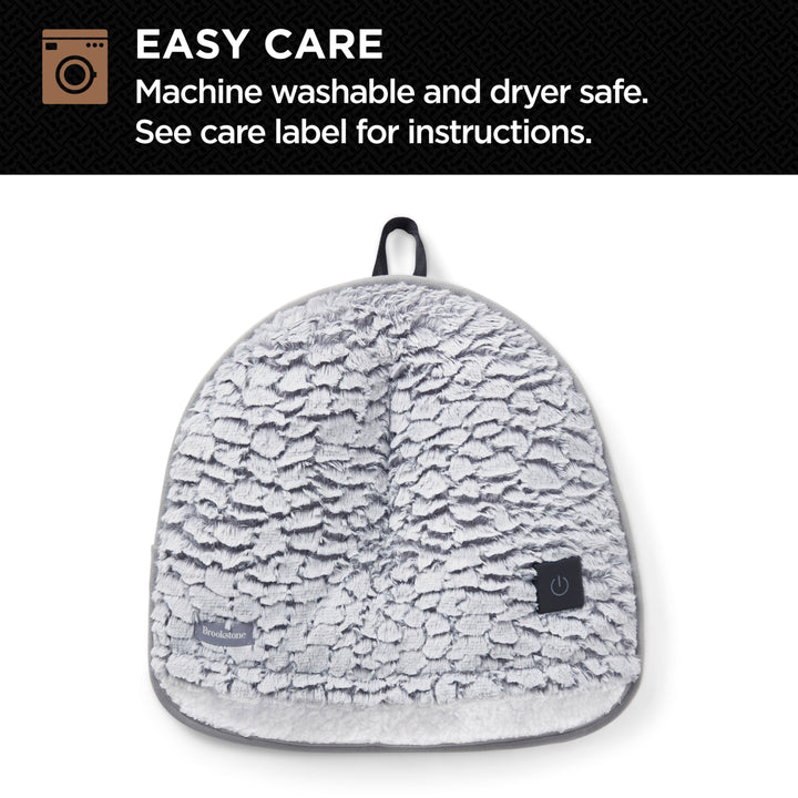 Gray textured foot warmer with care label on a white background