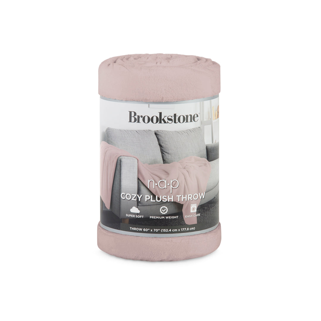 Pink plush throw blanket in packaging with Brookstone branding on a white background