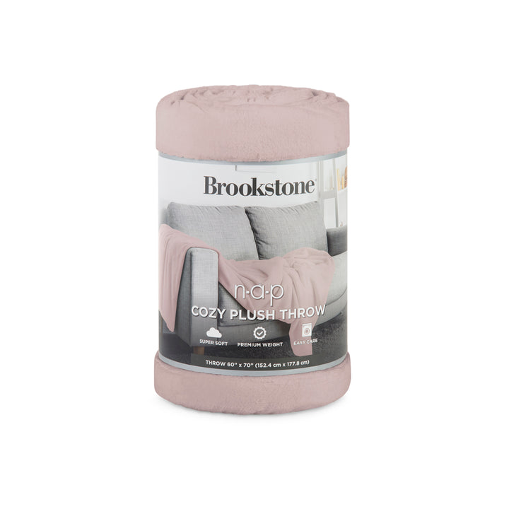 Pink plush throw blanket in packaging with Brookstone branding on a white background