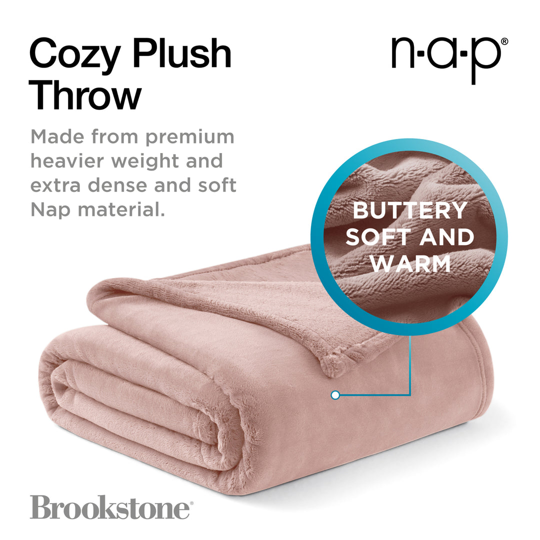 Cozy plush throw blanket with text highlighting its features on a white background