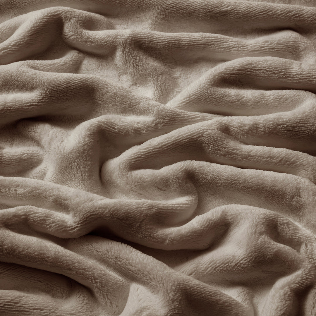 Close-up of textured beige fabric with wavy pattern