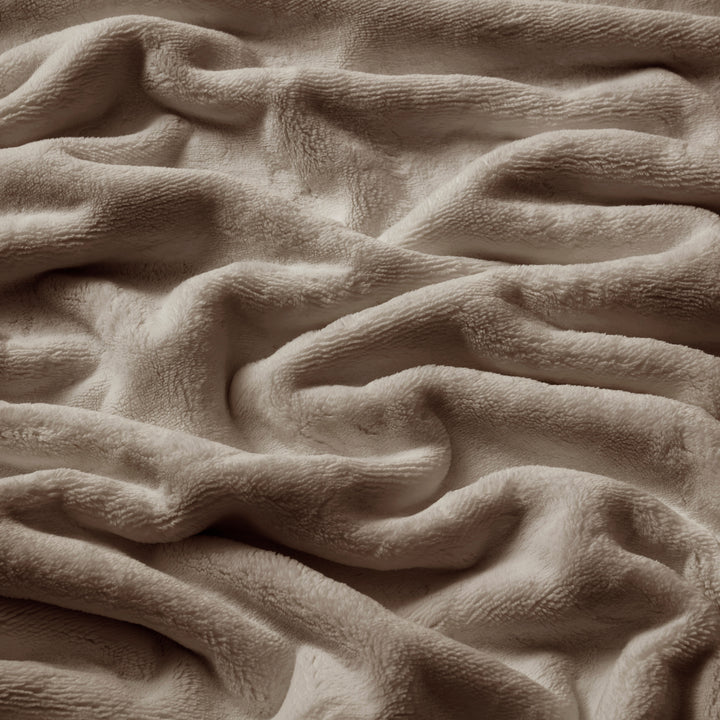 Close-up of textured beige fabric with wavy pattern