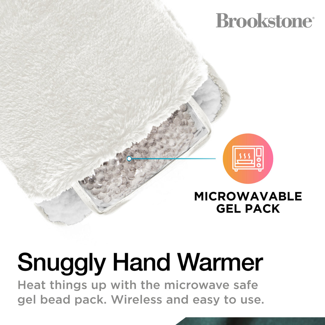 Snuggly hand warmer with microwavable gel pack and Brookstone branding.