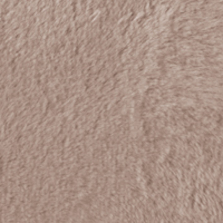 Close-up of a textured pinkish-brown fabric surface
