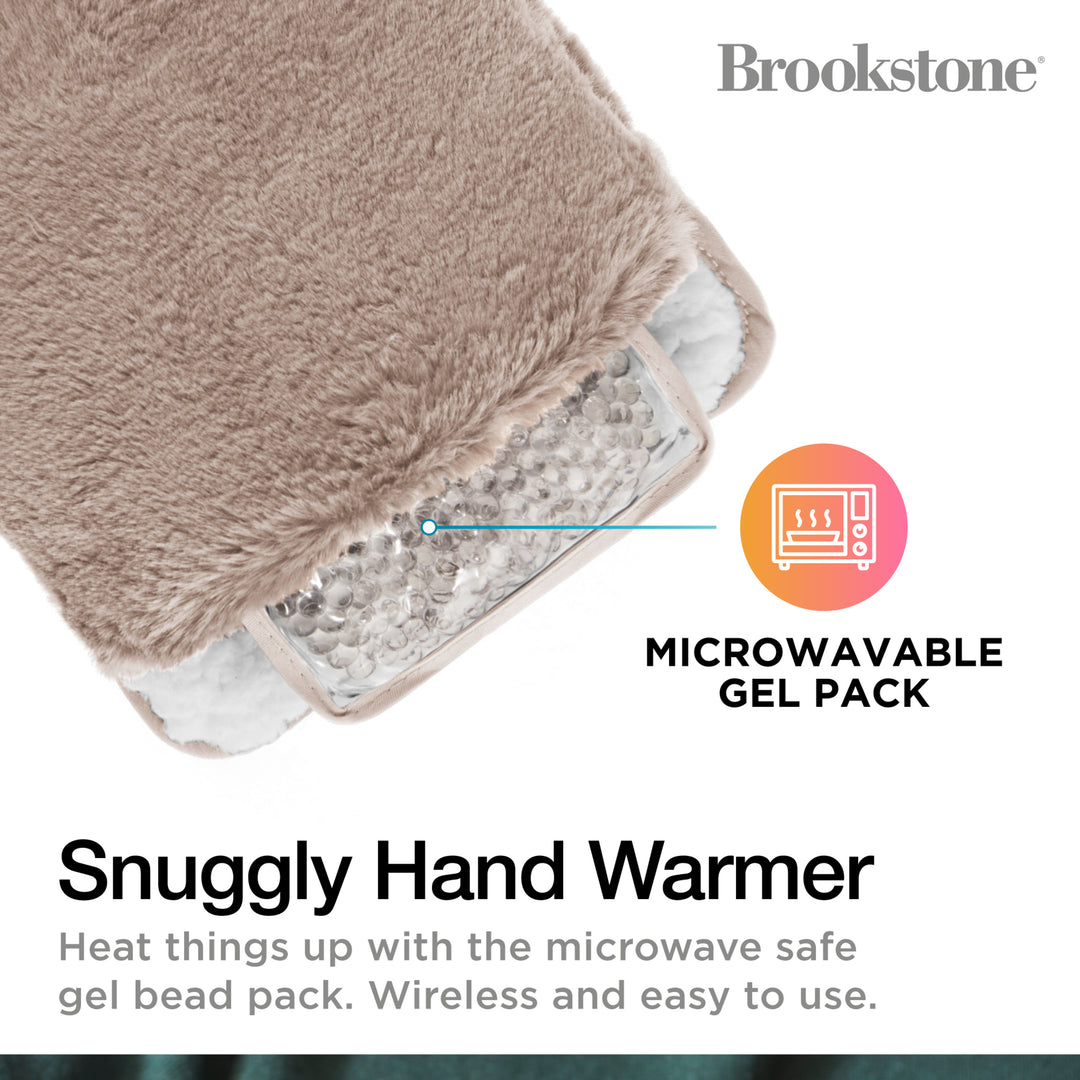 Snuggly hand warmer with microwavable gel pack and Brookstone branding.