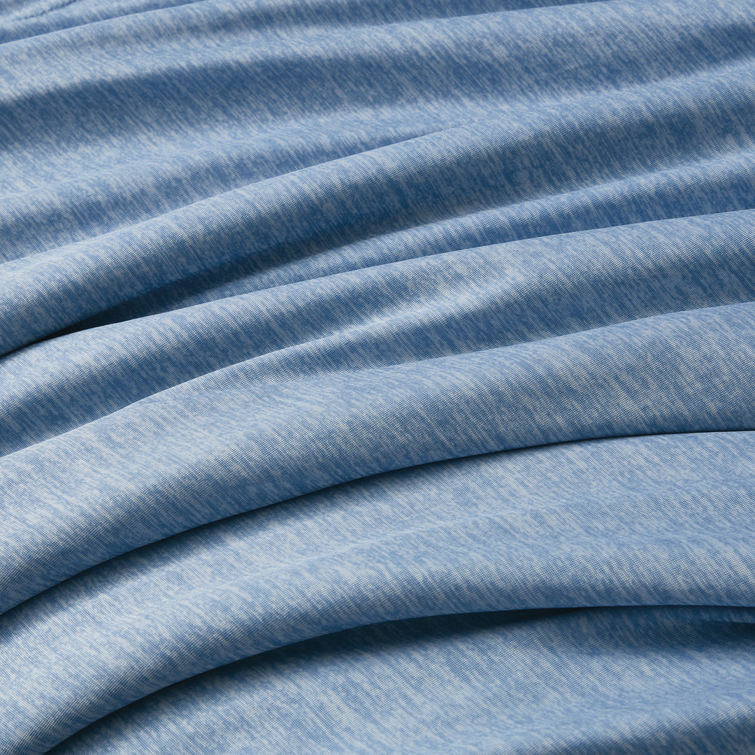 Close-up of blue fabric with visible texture and folds
