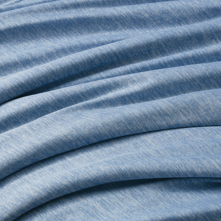 Close-up of blue fabric with visible texture and folds