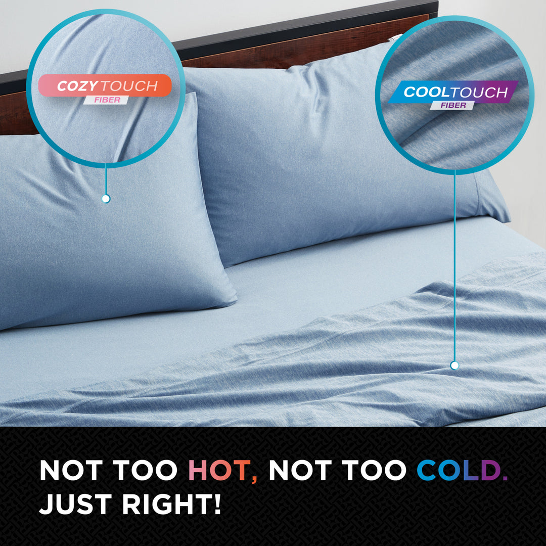 Blue bedding set with 'Cozy Touch' and 'Cool Touch' fibers labeled, on a bed.