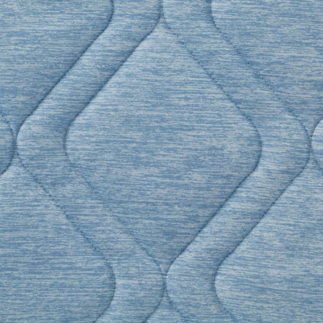 Close-up of textured blue fabric with wavy pattern