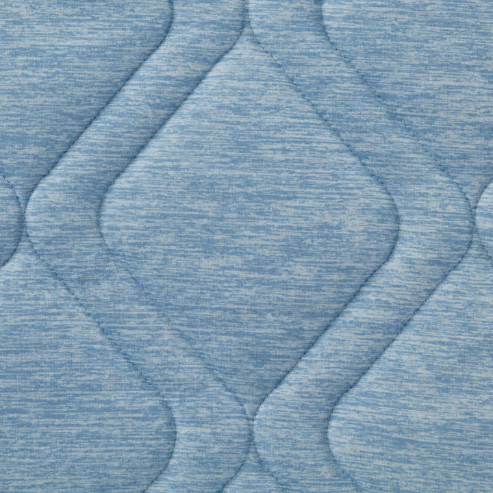 Close-up of textured blue fabric with wavy pattern