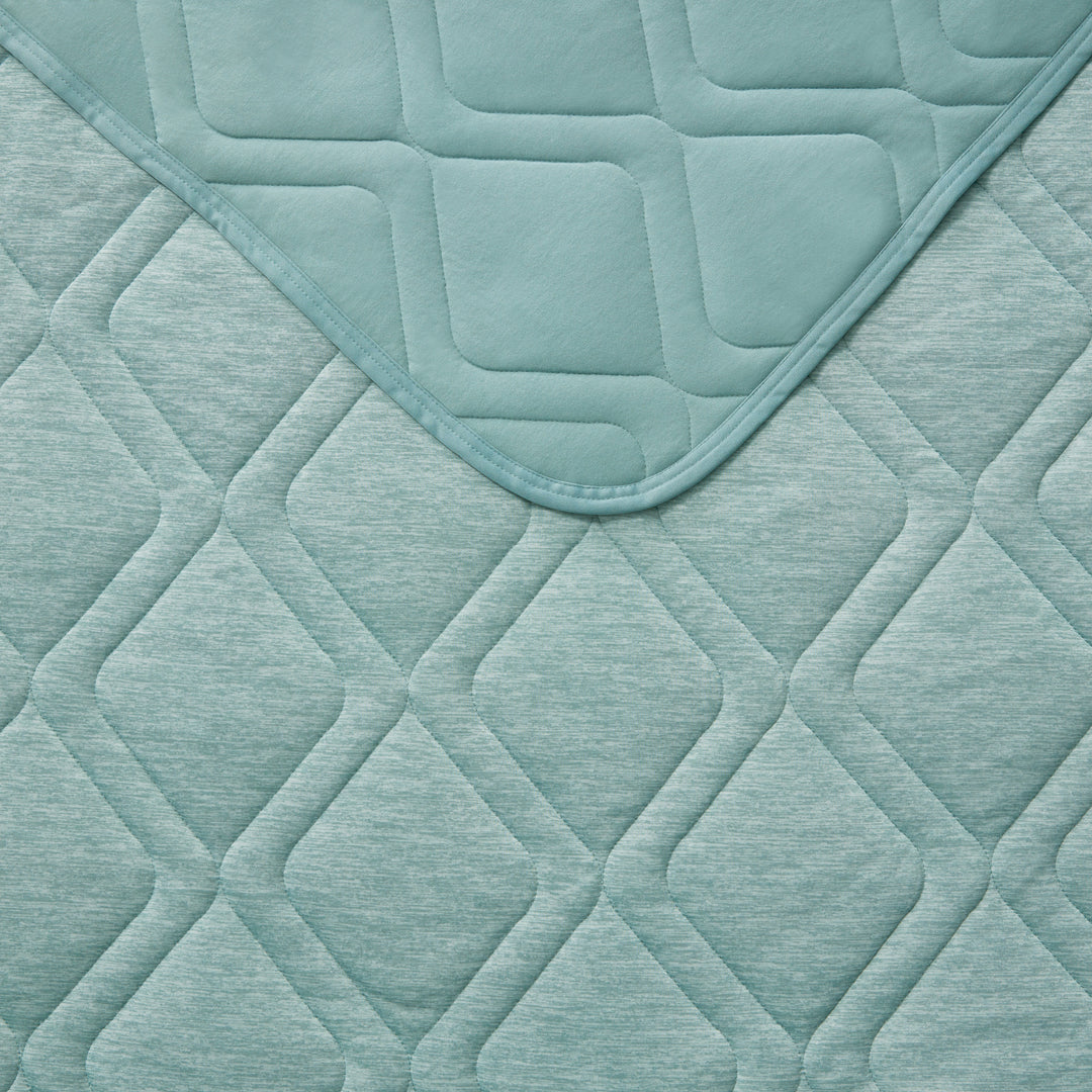 Teal quilted fabric with diamond pattern