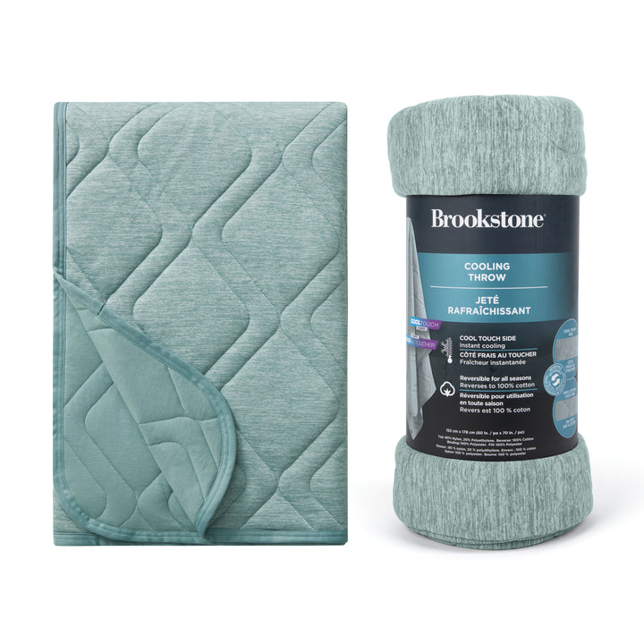 Teal cooling throw blanket with packaging on a white background