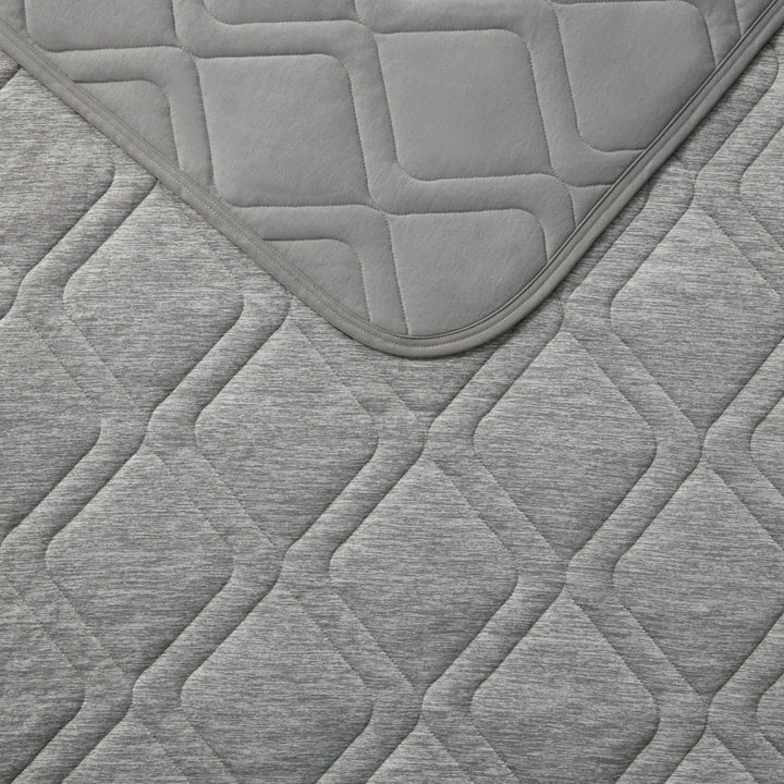 Gray quilted fabric with geometric pattern