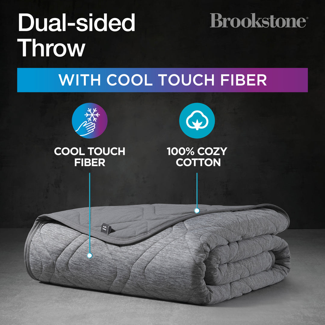Folded gray throw blanket with text about cool touch fiber and 100% cozy cotton, branded as Brookstone.