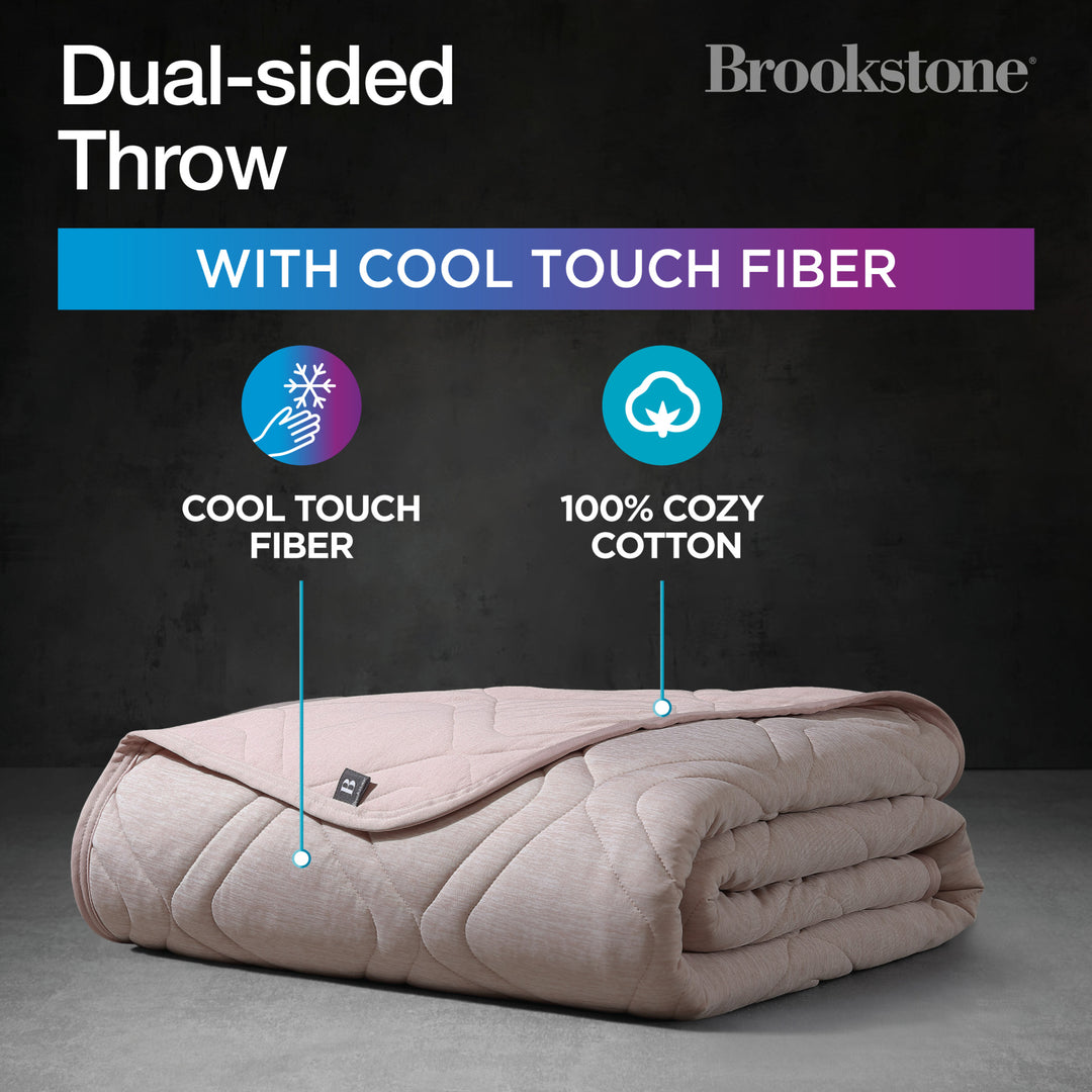 Folded dual-sided throw blanket with cool touch fiber and 100% cozy cotton on a dark background, featuring Brookstone branding.