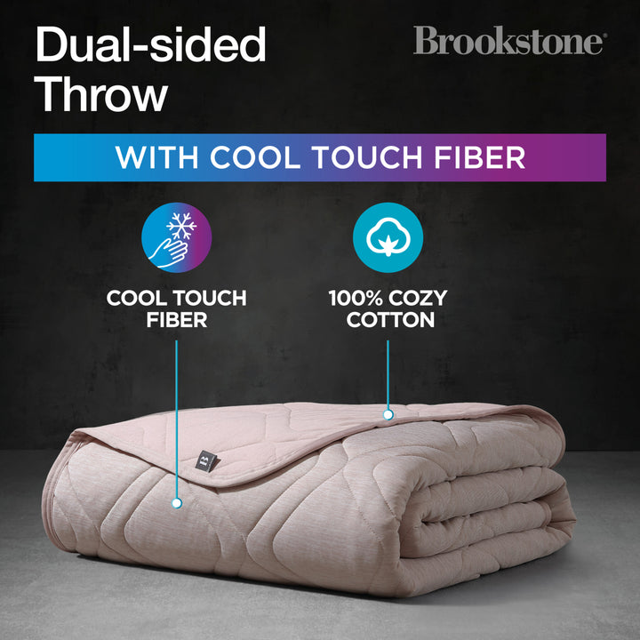Folded dual-sided throw blanket with cool touch fiber and 100% cozy cotton on a dark background, featuring Brookstone branding.
