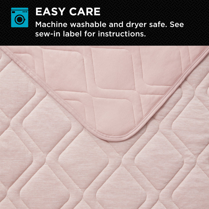 Quilted pink fabric with washing machine icon and text about ease of care.