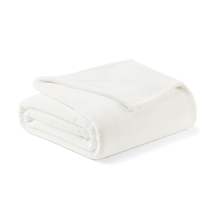 Folded white blanket on a white background