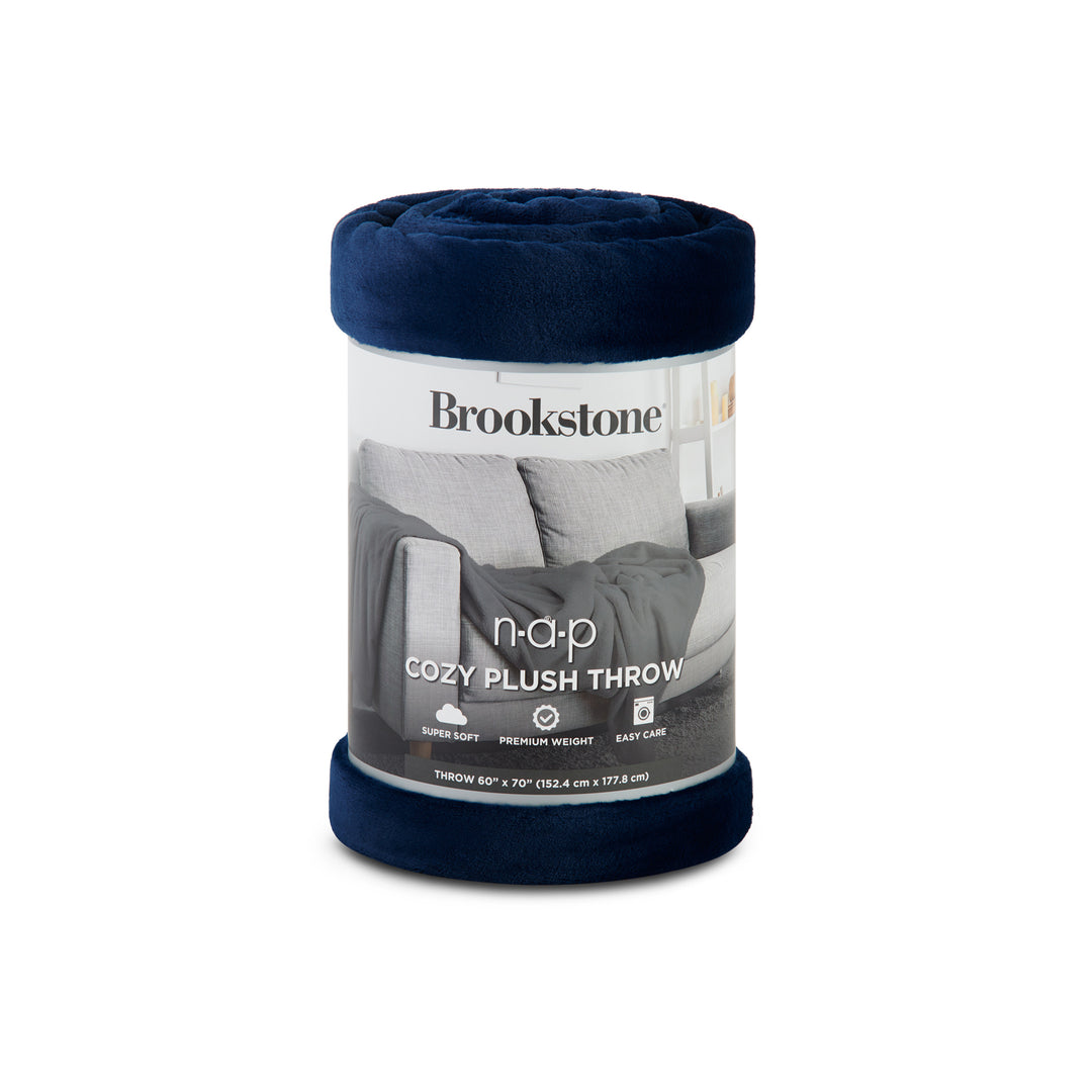 Navy Brookstone Nap Cozy Plush Throw blanket rolled in its retail packaging.