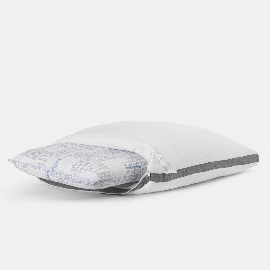 Pillow with gray and white patterns on a light gray background