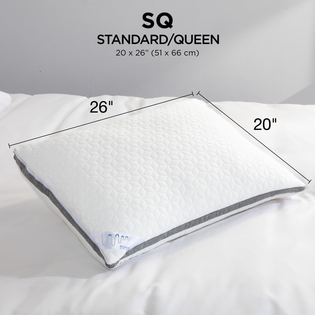 White pillow with measurements on a gray background