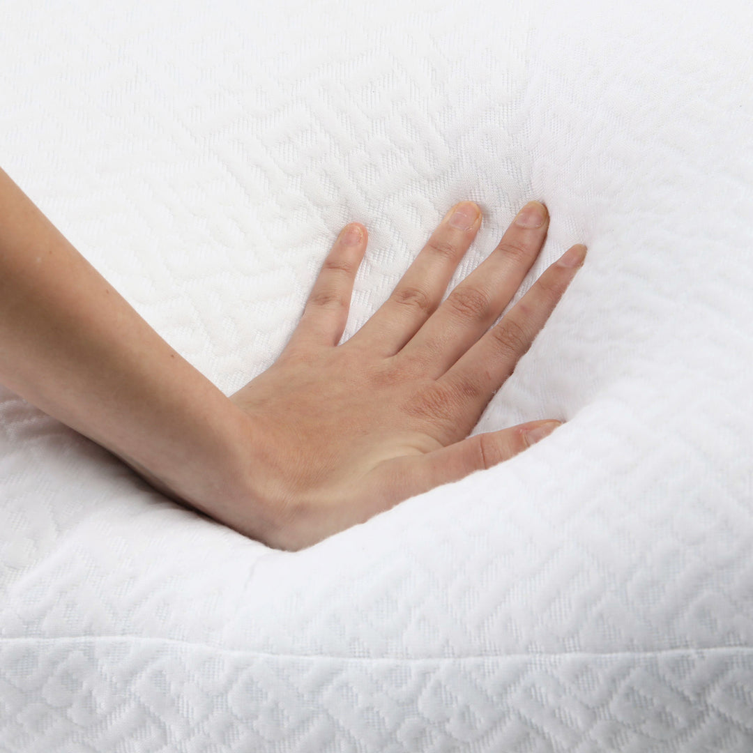 Hand resting on a white textured surface