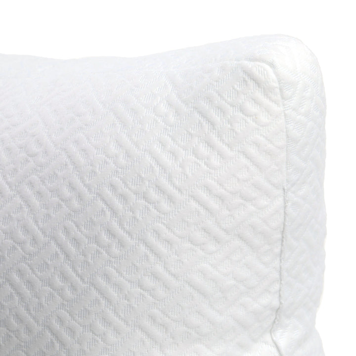 Close-up of a textured white fabric with a subtle pattern on a white background