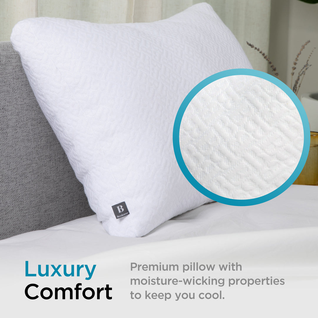 White pillow with moisture-wicking properties on a bed, close-up of texture shown.