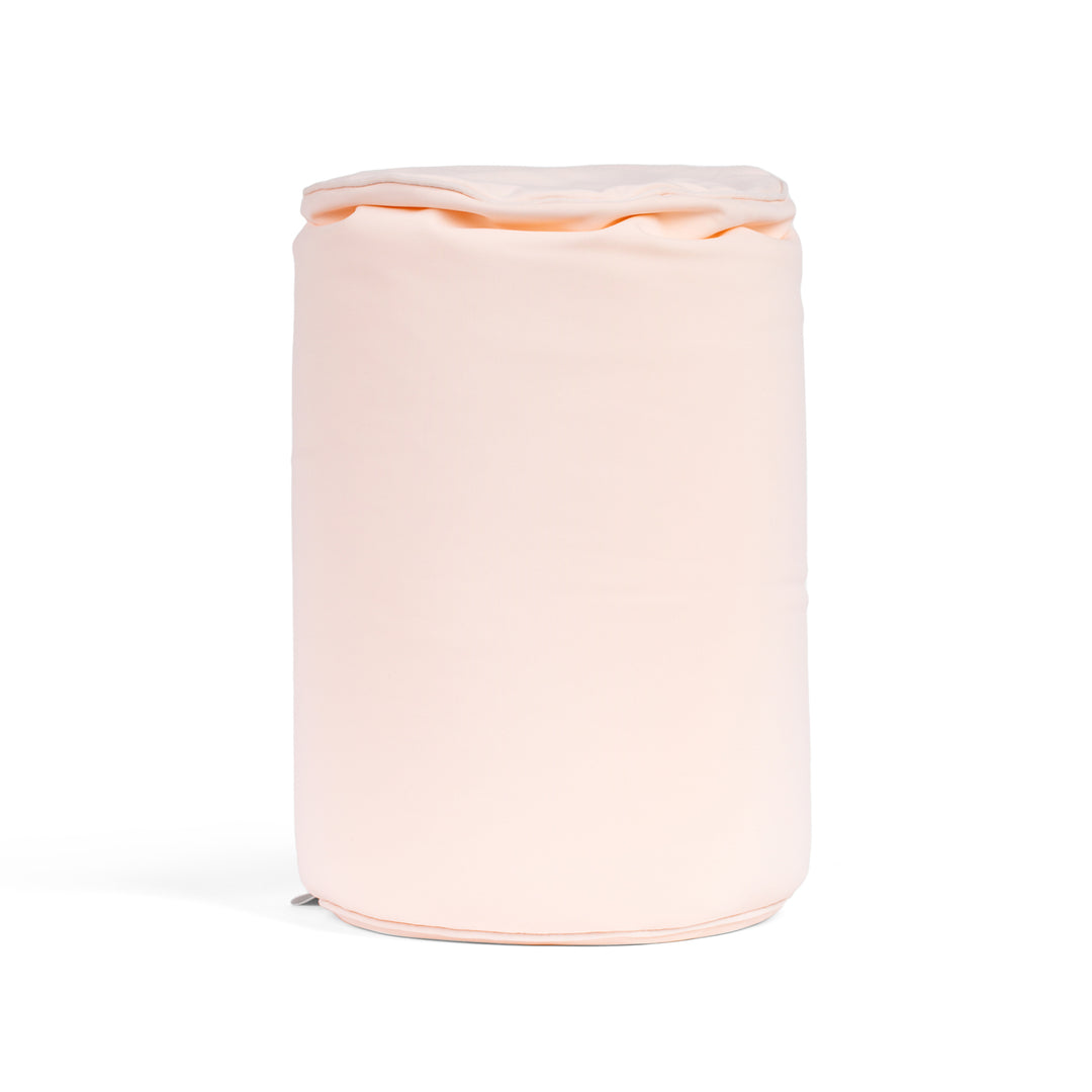 Pink cylindrical container with a lid on a white background
