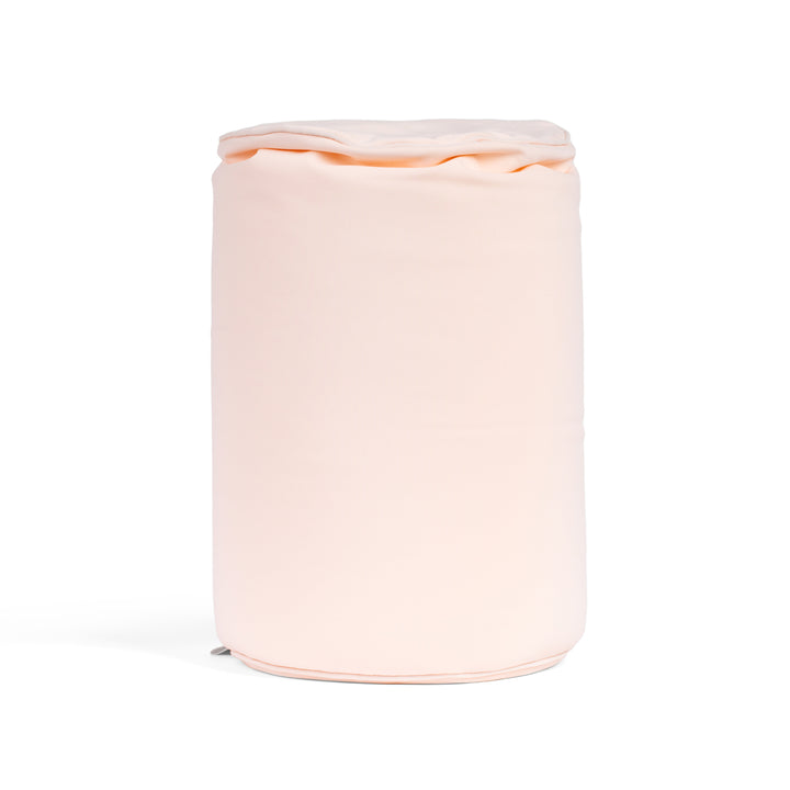 Pink cylindrical container with a lid on a white background