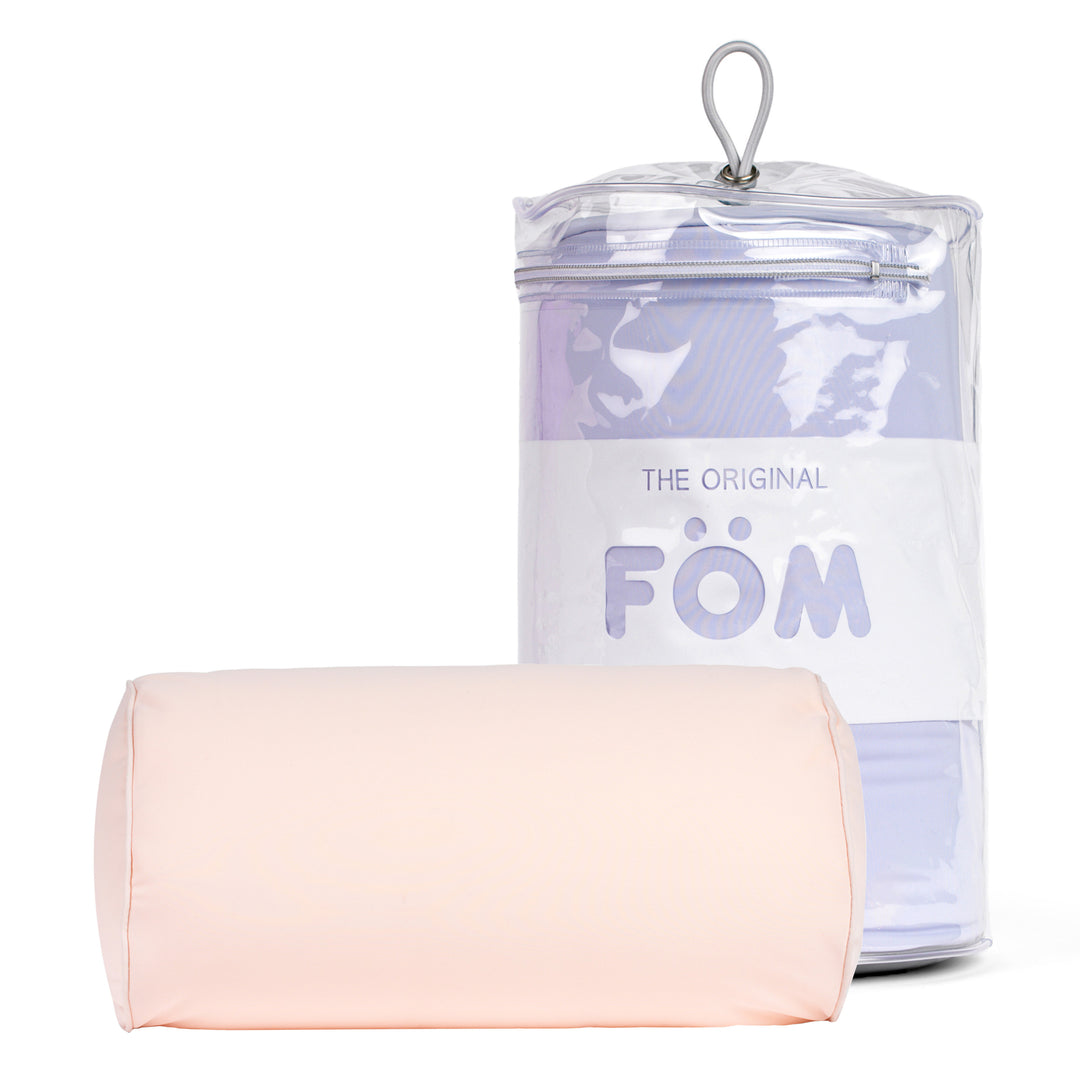 Pink cushion with clear container labeled 'Föm' on a white background