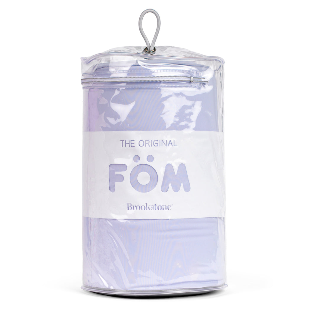 Clear container with cushion inside, branded 'FOM' on a white background