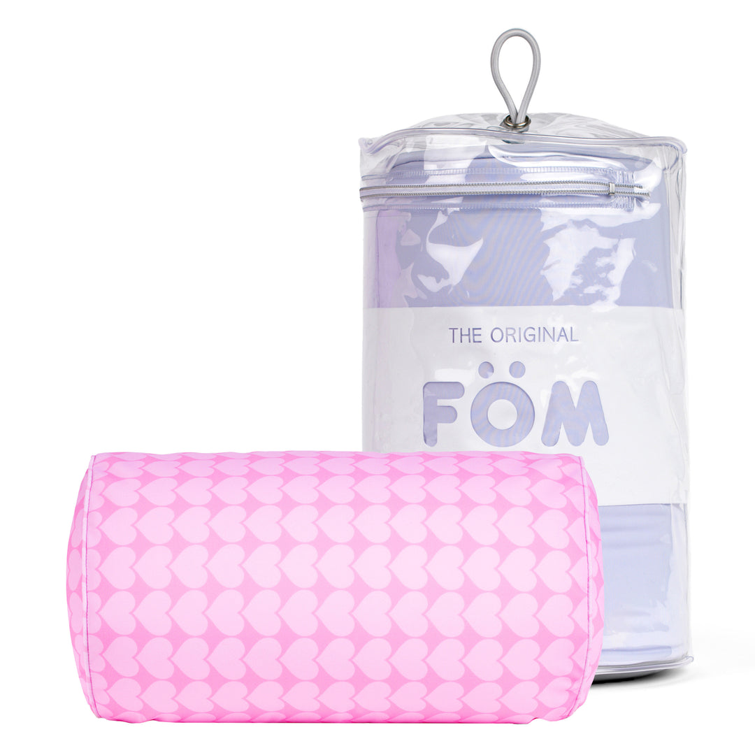 Pink textured towel with clear container labeled 'Föm' on a white background
