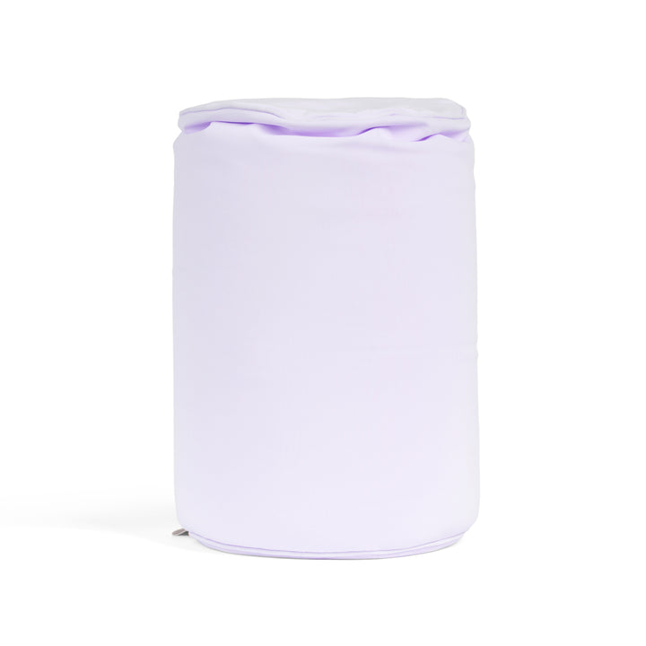 White cylindrical pillow with a purple lid on a white background