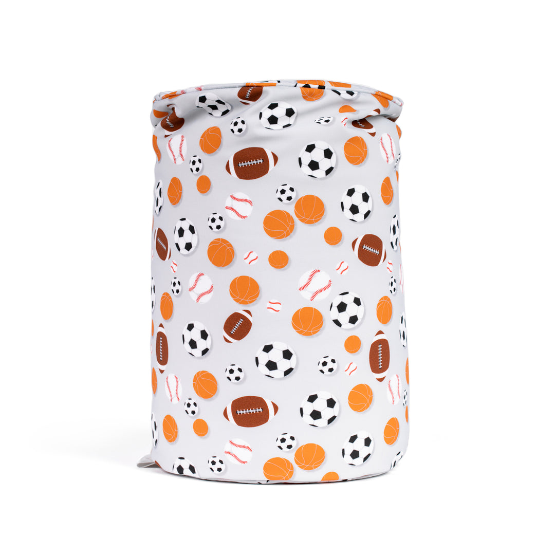 Cylindrical pillow with sports-themed pattern on a white background